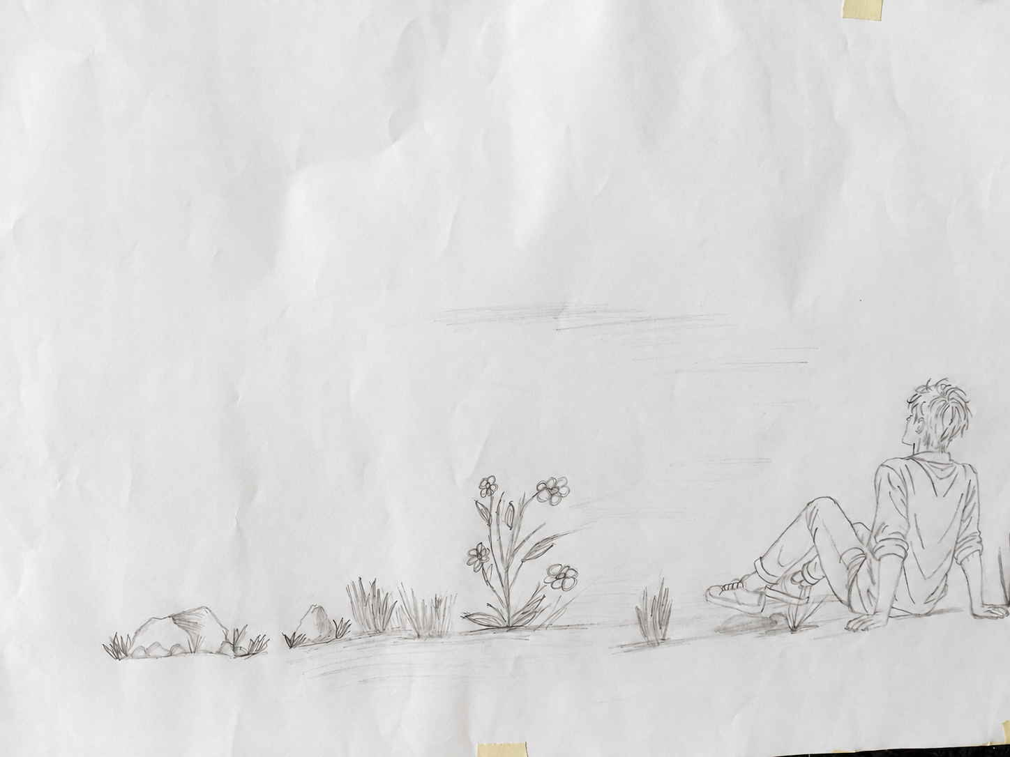 Boceto a lápiz de una persona joven sentada frente a un terreno abierto